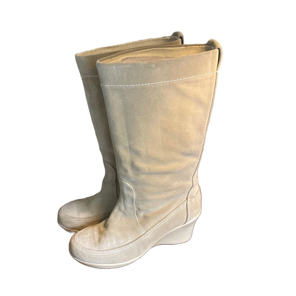 Size 7.5 tan NWOT You by Crocs Boots with awedge heel. Beautiful condition.